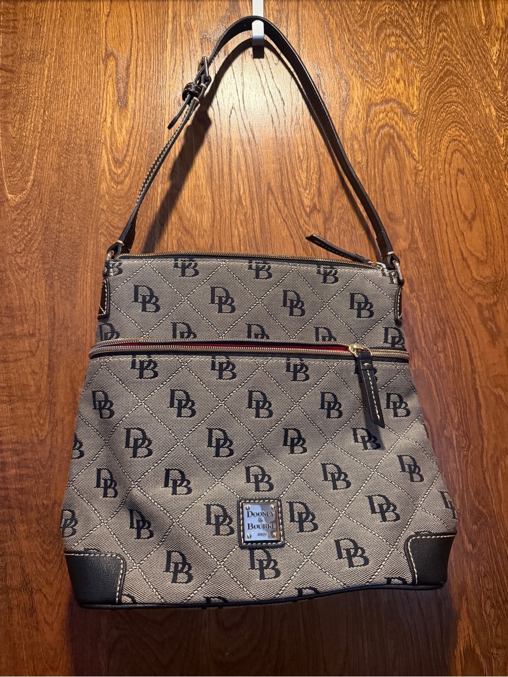 Dooney & Bourke DB Monogram Shoulder Bag with Black trim & red interior